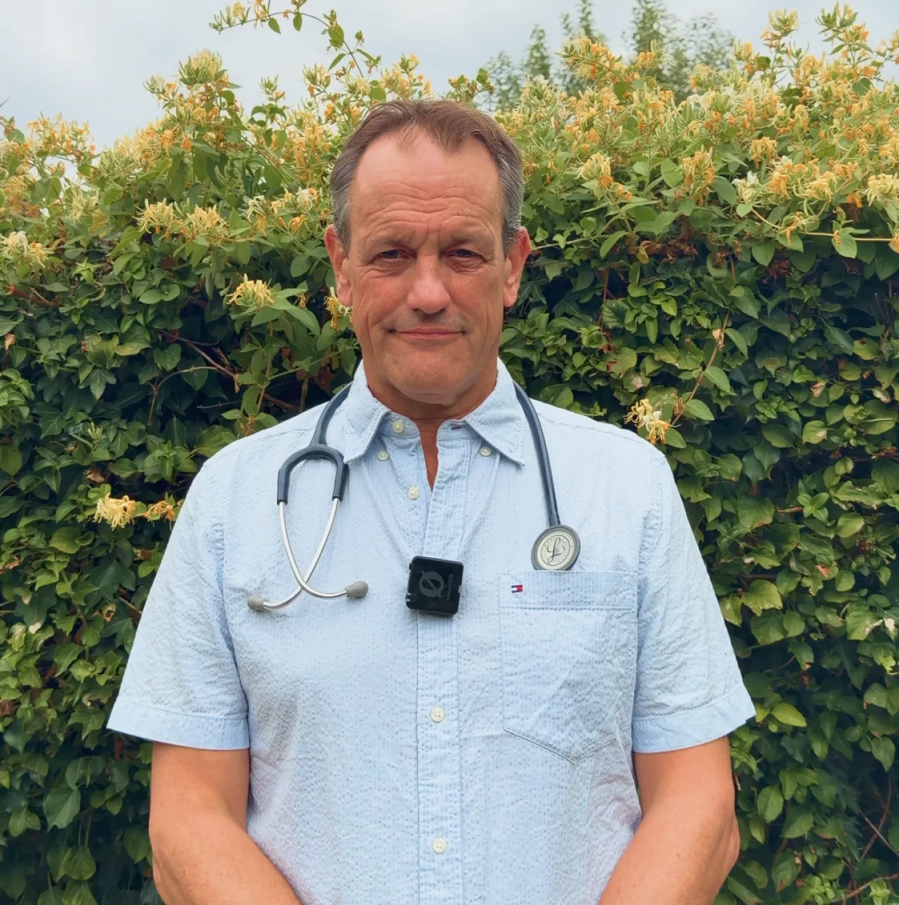 Andrew Bucher, Rocketo's vet and co-founder, wearing a stethoscope