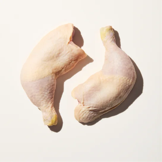 Two raw chicken legs